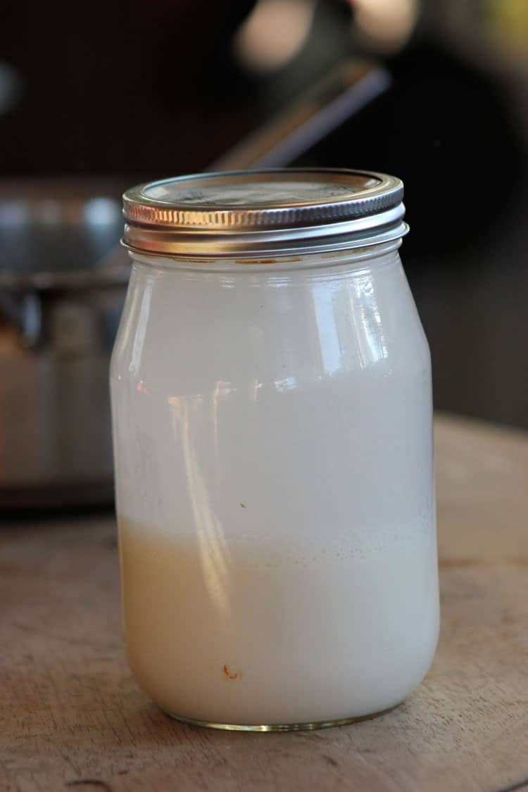 Cow's milk cream in a jar to make butter.