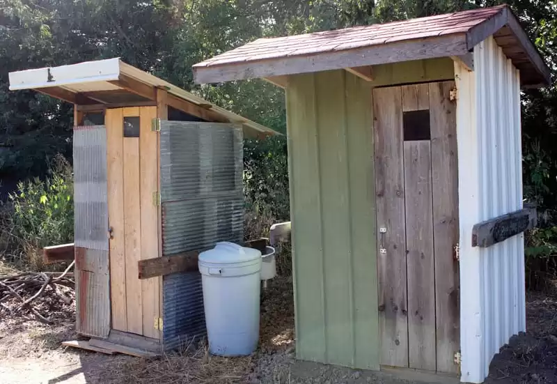 Two pit latrines at the Possibility Alliance, in Northeast Missouri. When the pits are full, they will be covered in topsoil, and allowed to decompose. In a few years, a fruit tree might be planted into the rich soil that has been created. 
