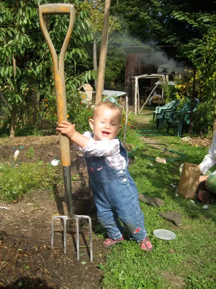 toddler helping in the garden