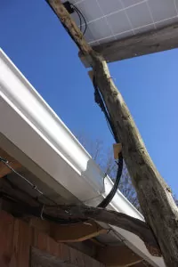 Wires attach to solar panels and lead into our home | Homestead Honey