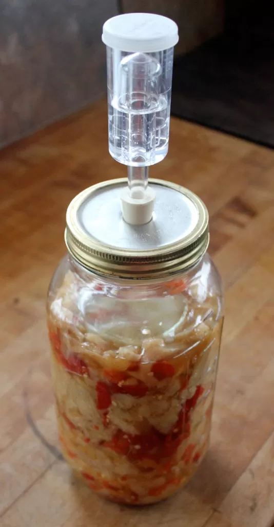 A spicy kraut ferments with a Fermentools airlock lid | Homestead Honey