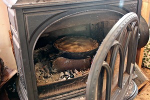 Don't have an oven? We don't either, and have come up with some ways to bake. This pie is about to bake in our wood stove! | Homestead Honey