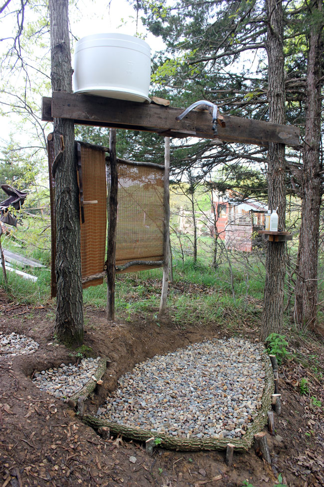 A homestead outdoor shower set up to work without running water | Homestead Honey