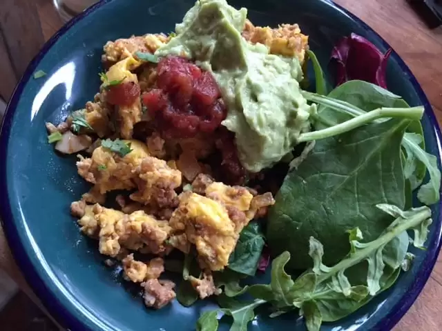 A whole30 breakfast of eggs and sausage, salad, salsa, and guacamole | Homestead Honey