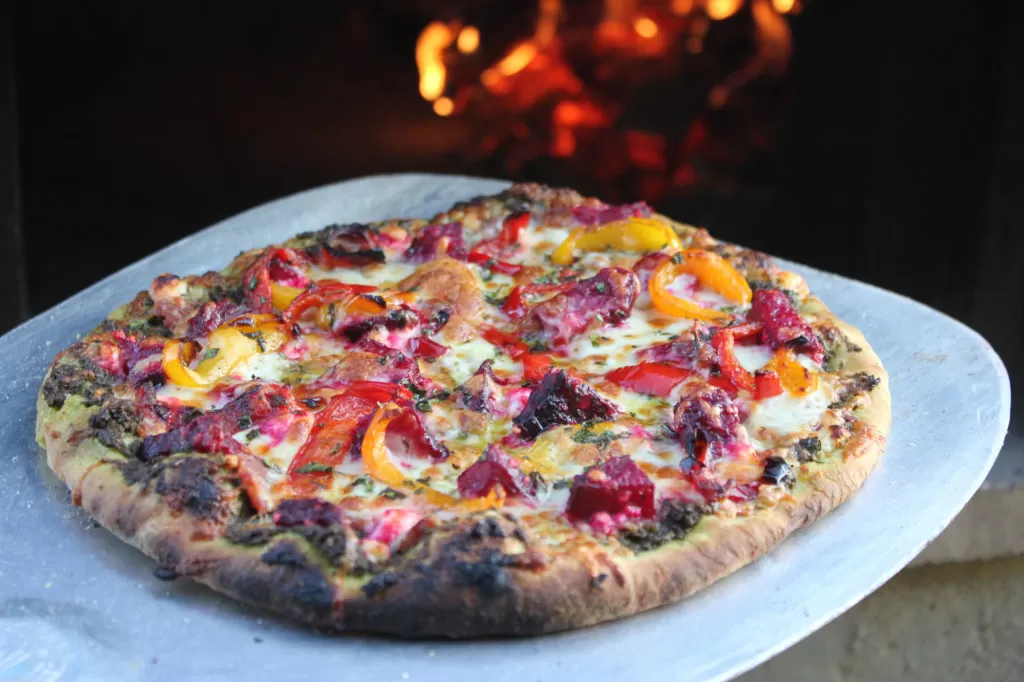 Pizza cooked in a wood-fired pizza oven