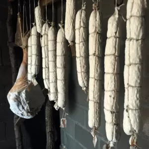 Salami curing in our homestead root cellar | Homestead Honey