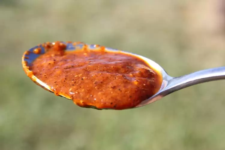 a tablespoon of lacto-fermented fire-roasted homemade jalapeno hot sauce 
