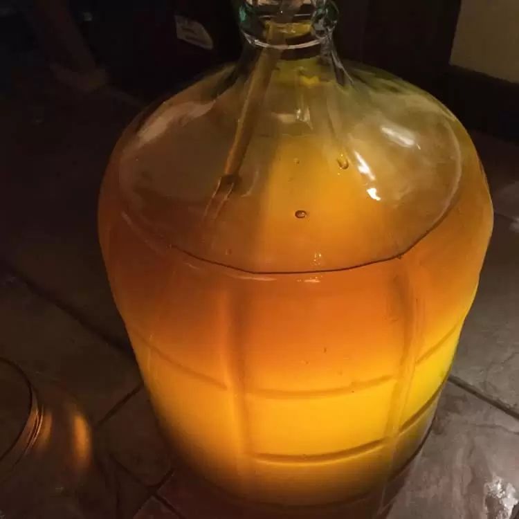 Racking your hard apple cider gives the beverage a more clear appearance and pure flavor
