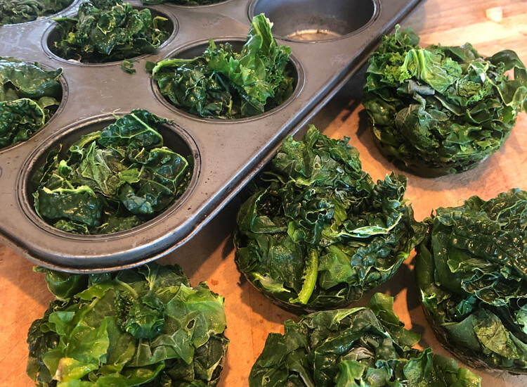 Kale can be frozen in muffin tins to make it easy to use in soups and stews later on!