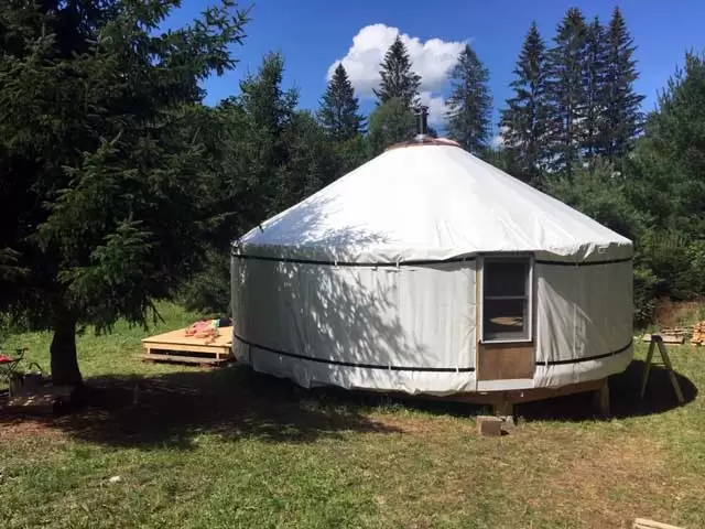 Our almost finished yurt, showing one of the hard windows